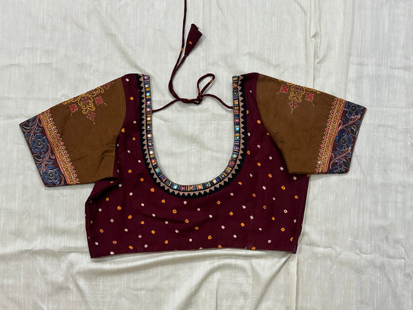 Cotton maroon Bandhani blouse with sleeves highlighted by zari embroidered border and intricate motifs - Size 40